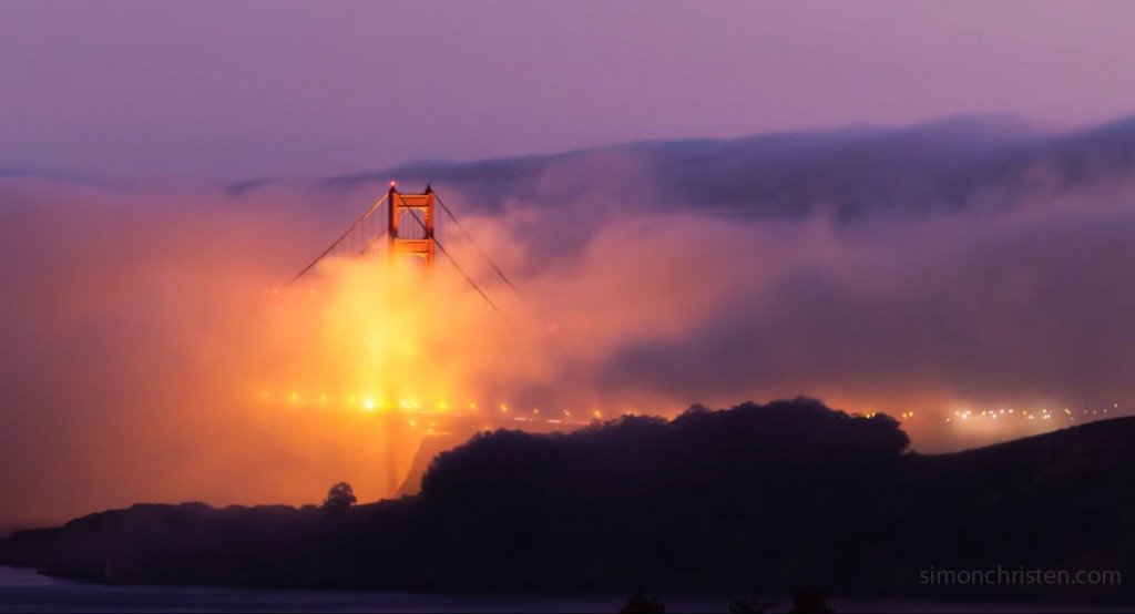 Golden Gate Bridge at night with Fog City Light screencap from timelapse video